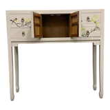 LIMS Legacy Singapore light grey console table with hand-painted birds and blossoms, two drawers, and a central cabinet with brass pulls.